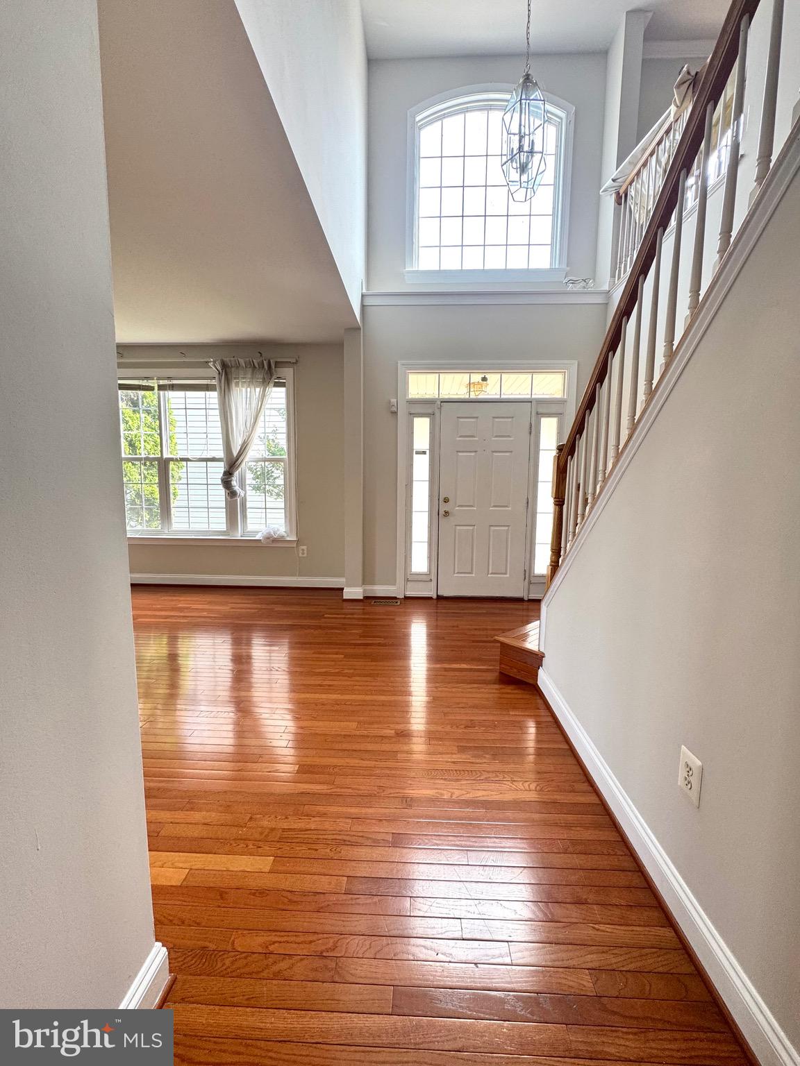 12447 Red Patch Lane Fairfax, VA 22033 - Photo 16 of 34 a view of an empty room with wooden floor and a window
