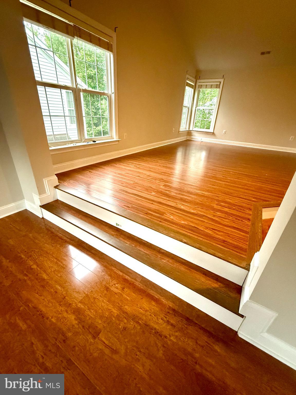 12447 Red Patch Lane Fairfax, VA 22033 - Photo 20 of 34 a view of empty room with window and wooden floor