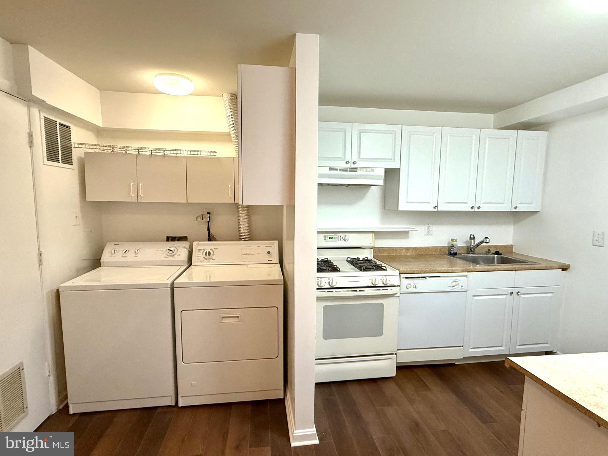 12447 Red Patch Lane Fairfax, VA 22033 - Photo 31 of 34 a view of a kitchen with sink and wooden floor