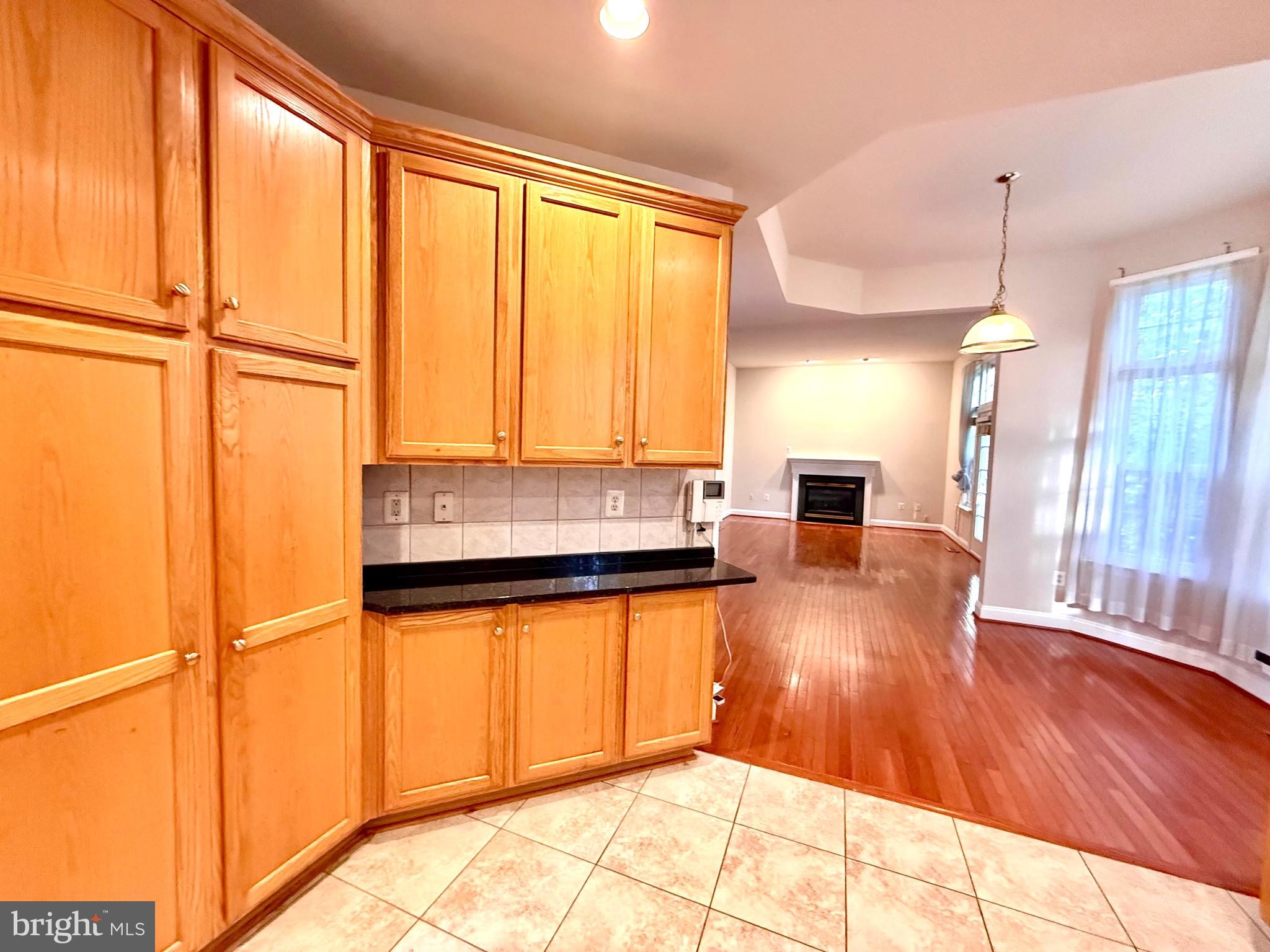 12447 Red Patch Lane Fairfax, VA 22033 - Photo 9 of 34 a kitchen with stainless steel appliances granite countertop a refrigerator a sink and a stove