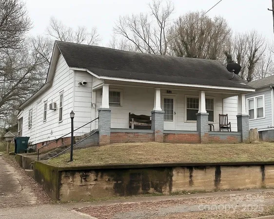 a view of house with roof deck