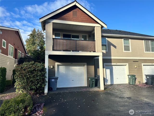 a front view of a house with garage