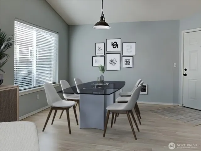 a view of a dining room with furniture window and wooden floor
