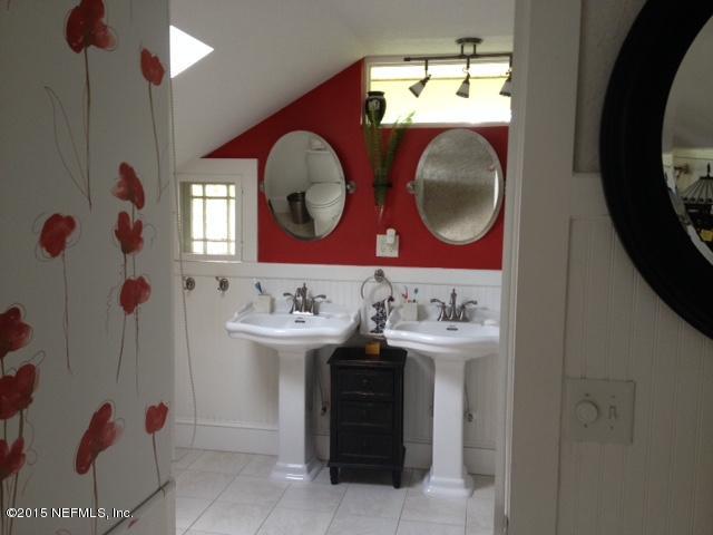 41 Rohde Avenue St. Augustine, FL 32084 - Photo 14 of 16 a bathroom with a sink and a mirror