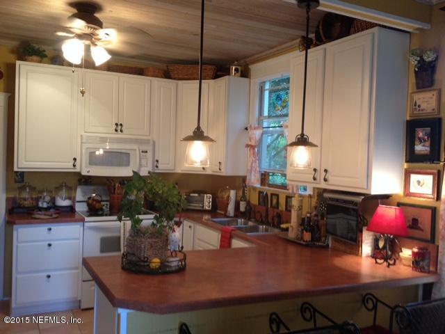 41 Rohde Avenue St. Augustine, FL 32084 - Photo 4 of 16 a kitchen with counter space cabinets and appliances