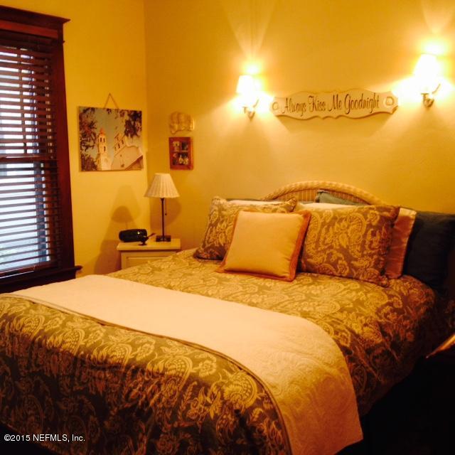 41 Rohde Avenue St. Augustine, FL 32084 - Photo 8 of 16 a bedroom with a bed and a night stand