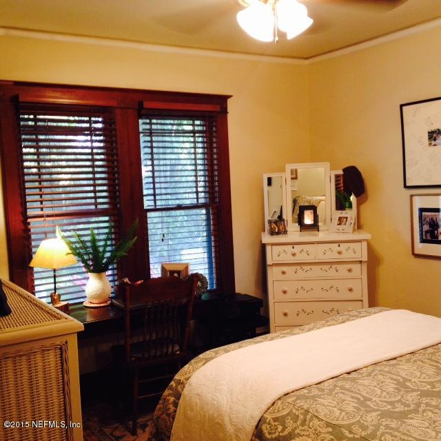 41 Rohde Avenue St. Augustine, FL 32084 - Photo 10 of 16 a bedroom with a bed and dresser with mirror