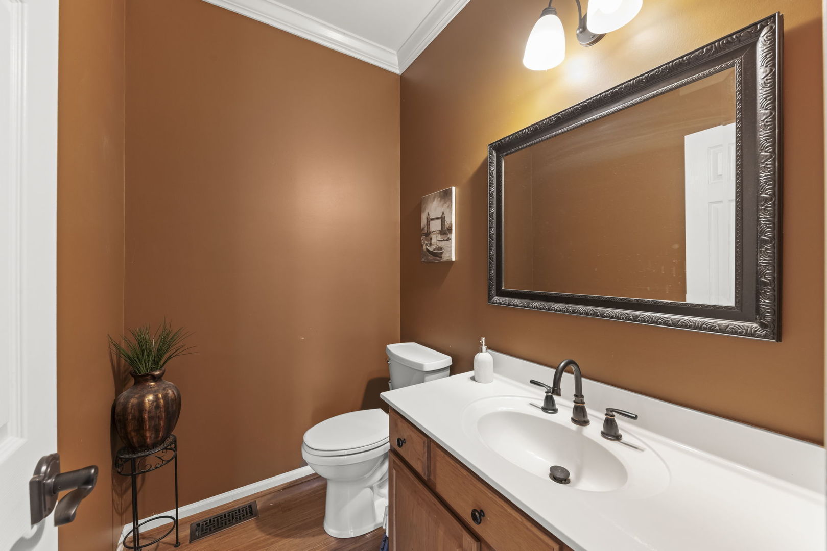 2723 Rosehall Lane Aurora, IL 60503 - Photo 12 of 23 a bathroom with a toilet a sink and mirror