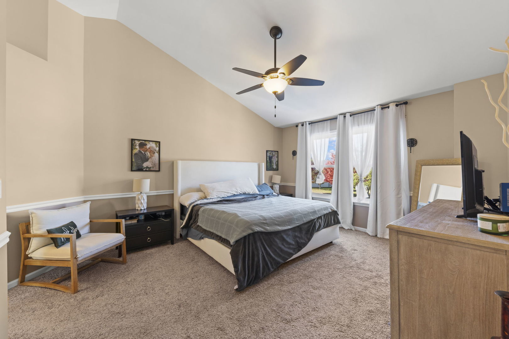 2723 Rosehall Lane Aurora, IL 60503 - Photo 13 of 23 a spacious bedroom with a bed and a flat screen tv