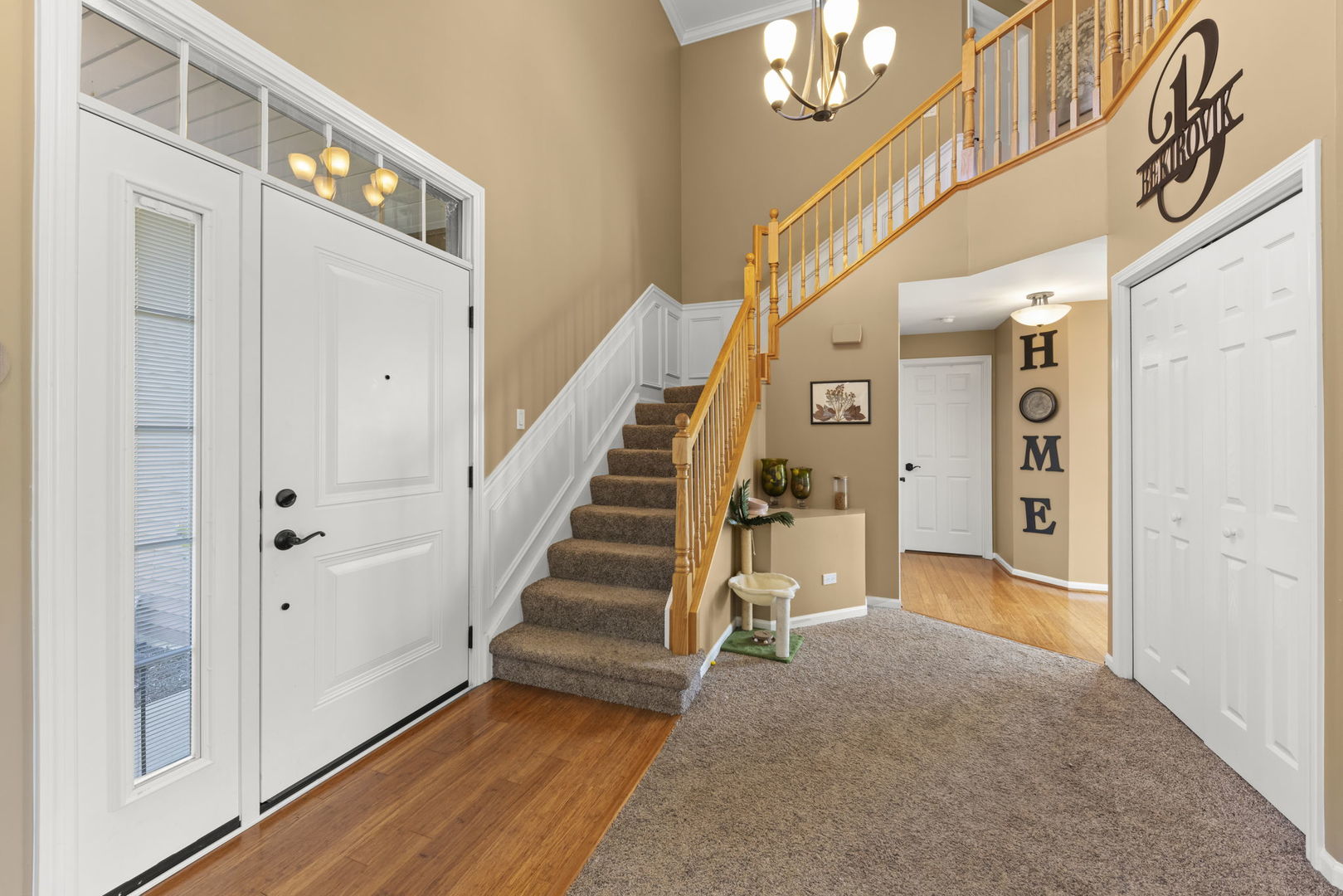 2723 Rosehall Lane Aurora, IL 60503 - Photo 3 of 23 a view of a hallway with a white walls and stairs