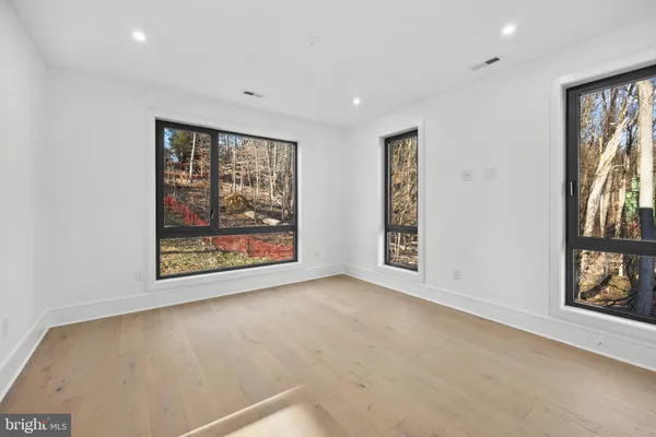 a dining room with a table and chairs