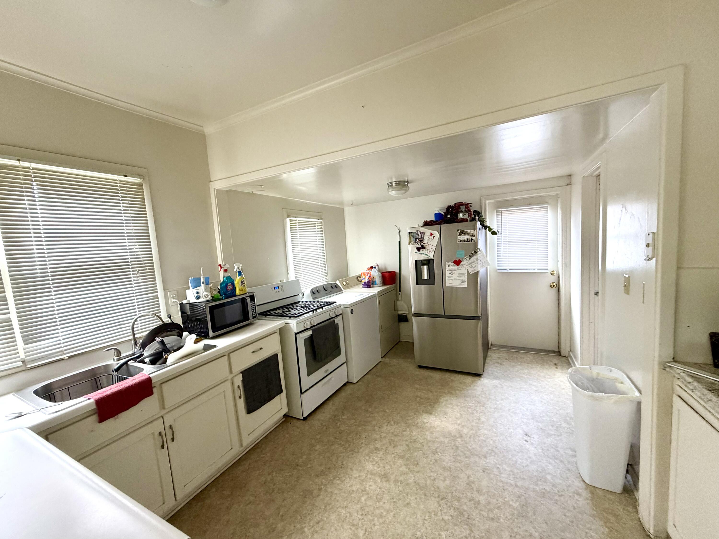 200 North B Street Exeter, CA 93221 - Photo 6 of 20 a kitchen with a sink and appliances