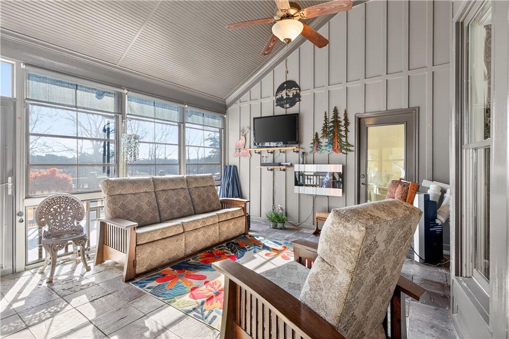 905 Old Forge Lane Jefferson, GA 30549 - Photo 13 of 69 a living room with furniture a flat screen tv and a window