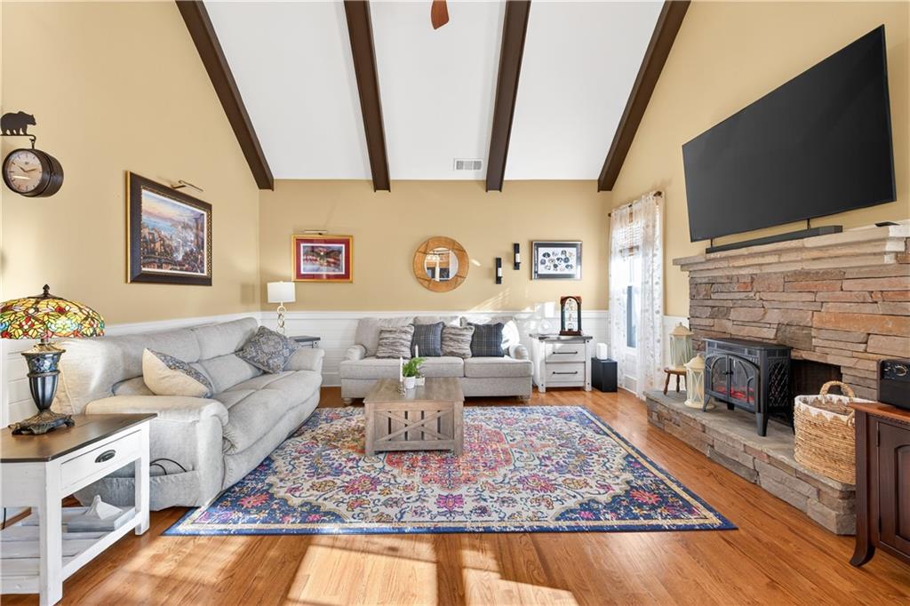 905 Old Forge Lane Jefferson, GA 30549 - Photo 22 of 69 a living room with furniture and a flat screen tv