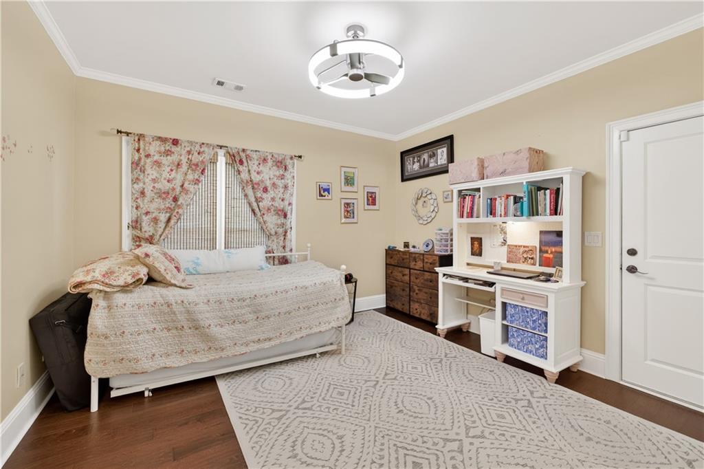 905 Old Forge Lane Jefferson, GA 30549 - Photo 26 of 69 a bedroom with a bed cabinets and window