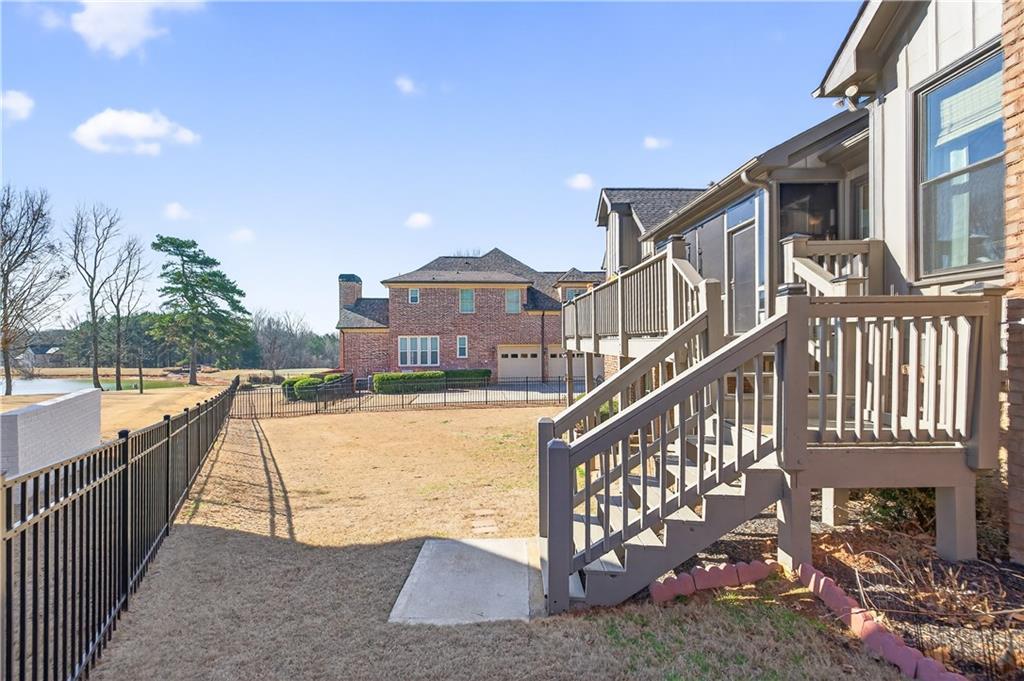 905 Old Forge Lane Jefferson, GA 30549 - Photo 58 of 69 a view of a house with a small yard and wooden fence
