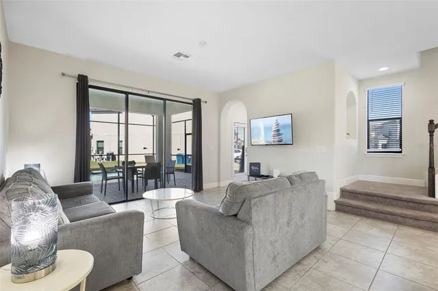 a bedroom with a bed and a lamp