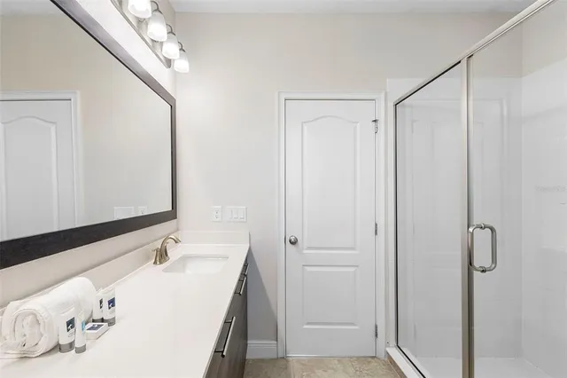 a dining room with furniture and large windows