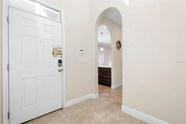 a dining room with furniture a rug and wooden floor