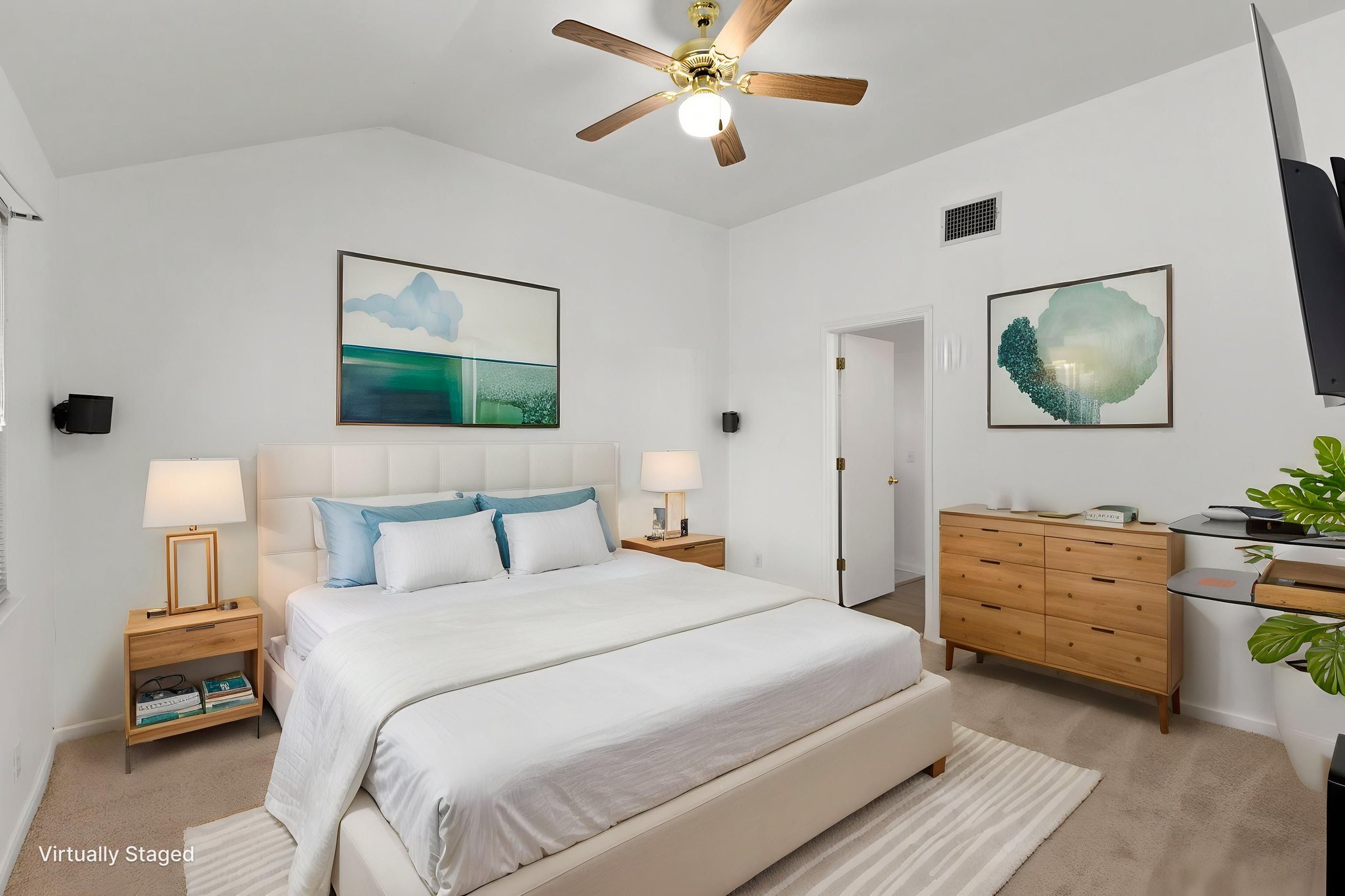 290 Bailey Loop Kyle, TX 78640 - Photo 18 of 33 Vaulted ceilings define this bedroom, featuring neutral-toned carpeting, a ceiling fan with integrated lighting, and a wall-mounted television