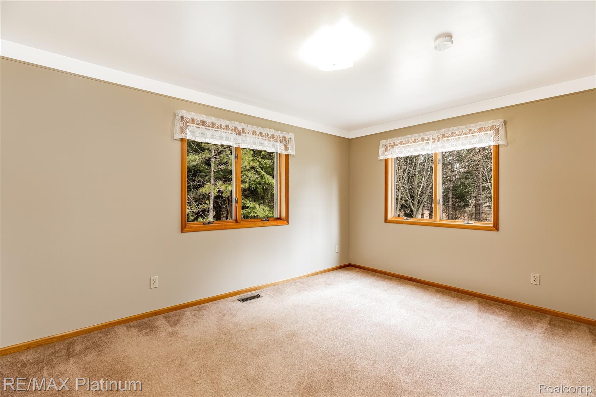 909 Chase Lake Road Howell, MI 48855 - Photo 24 of 37 Large Bedroom #1 with more great views!
