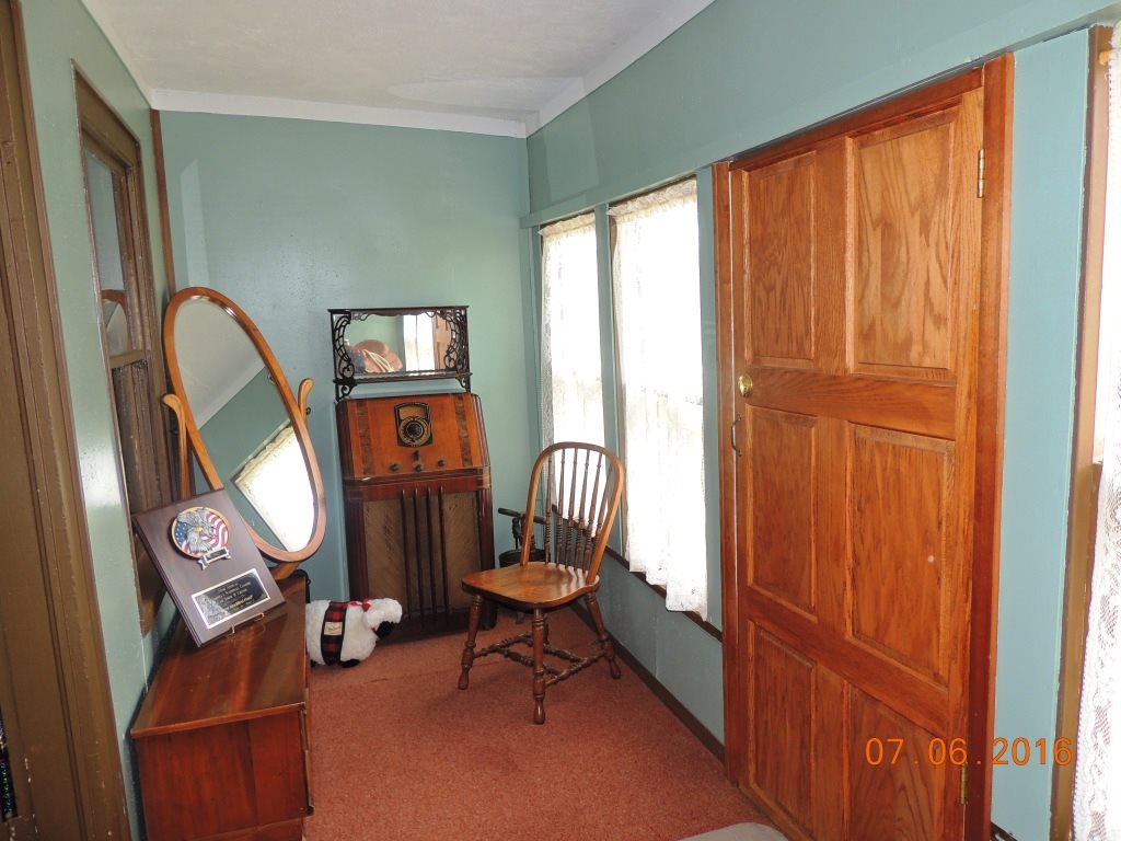 2838 Poole Road Belvidere, IL 61008 - Photo 1 of 1 a living room with furniture a window and a fireplace