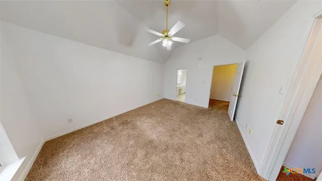 a view of a room with a sink and a mirror