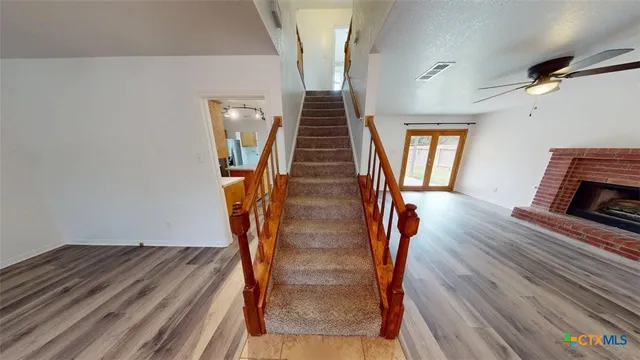 a view of entryway with wooden floor