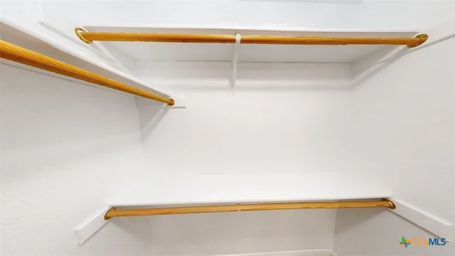 a bathroom with a small bathtub and a shower