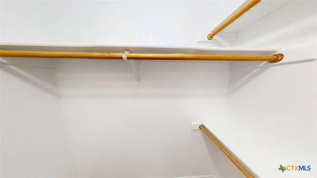 a view of a room and wooden floor