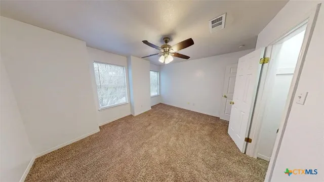 a view of a hallway with a chandelier