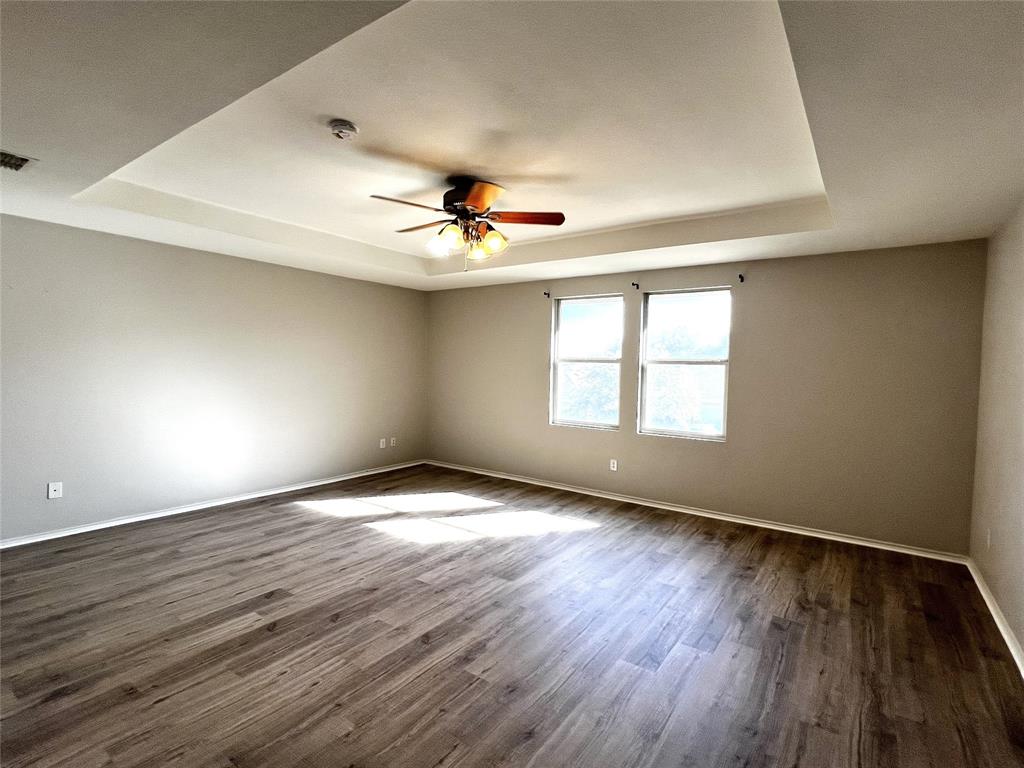 12864 Cowper Drive Frisco, TX 75035 - Photo 14 of 28 wooden floor in an empty room with a window