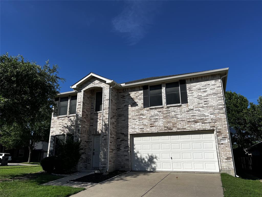 12864 Cowper Drive Frisco, TX 75035 - Photo 2 of 28 a front view of a house with a yard