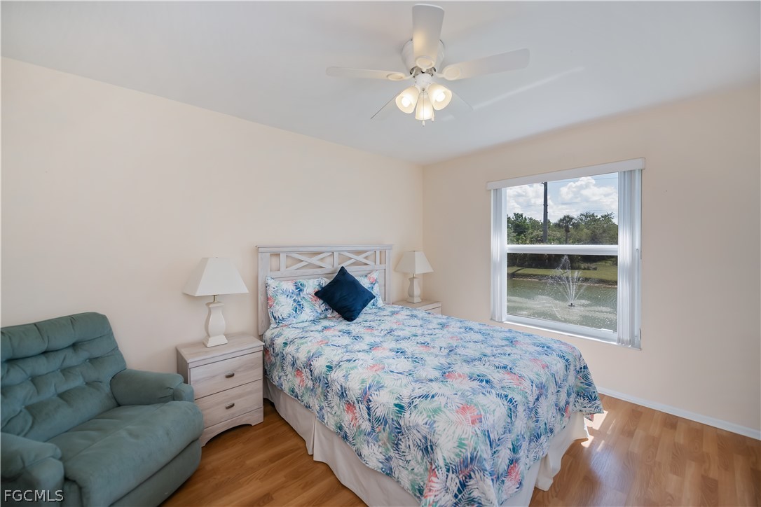 1100 Pondella Road, Unit 514 Cape Coral, FL 33909 - Photo 17 of 34 a bedroom with a bed couch and window