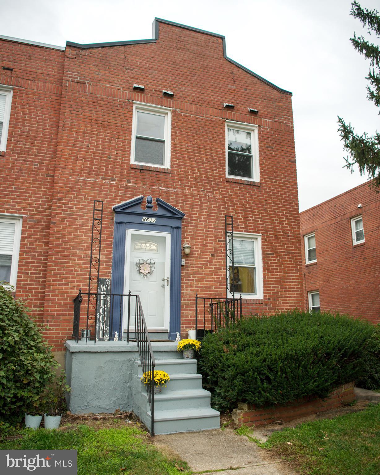 8637 Oak Road Baltimore, MD 21234 - Photo 1 of 18 a front view of a house with garden and plants