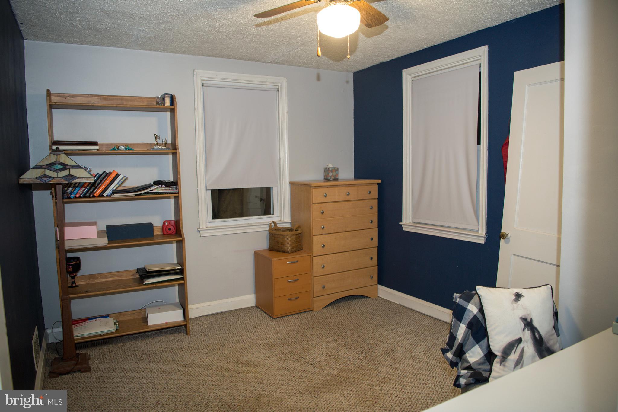 8637 Oak Road Baltimore, MD 21234 - Photo 11 of 18 a view of room with stairs and furniture