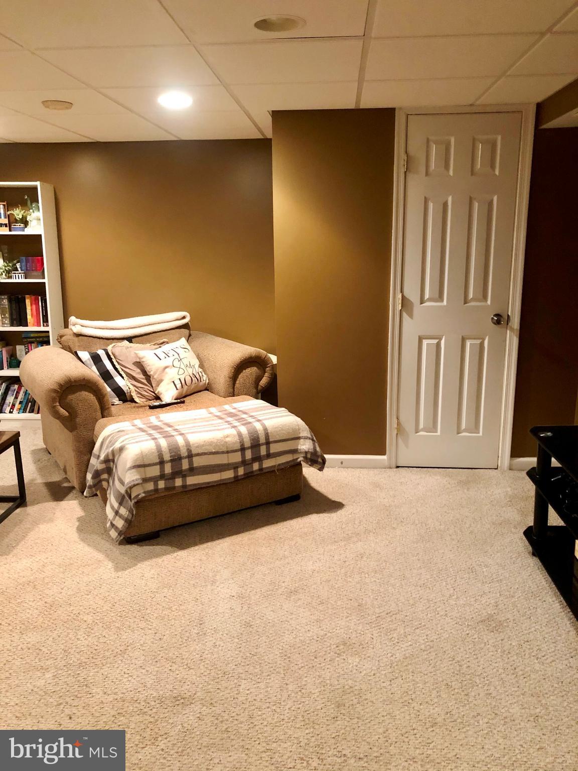 8637 Oak Road Baltimore, MD 21234 - Photo 17 of 18 a bedroom with a bed and a flat screen tv