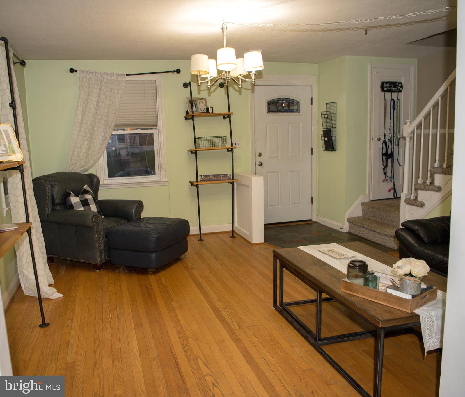 8637 Oak Road Baltimore, MD 21234 - Photo 3 of 18 a living room with furniture and a chandelier