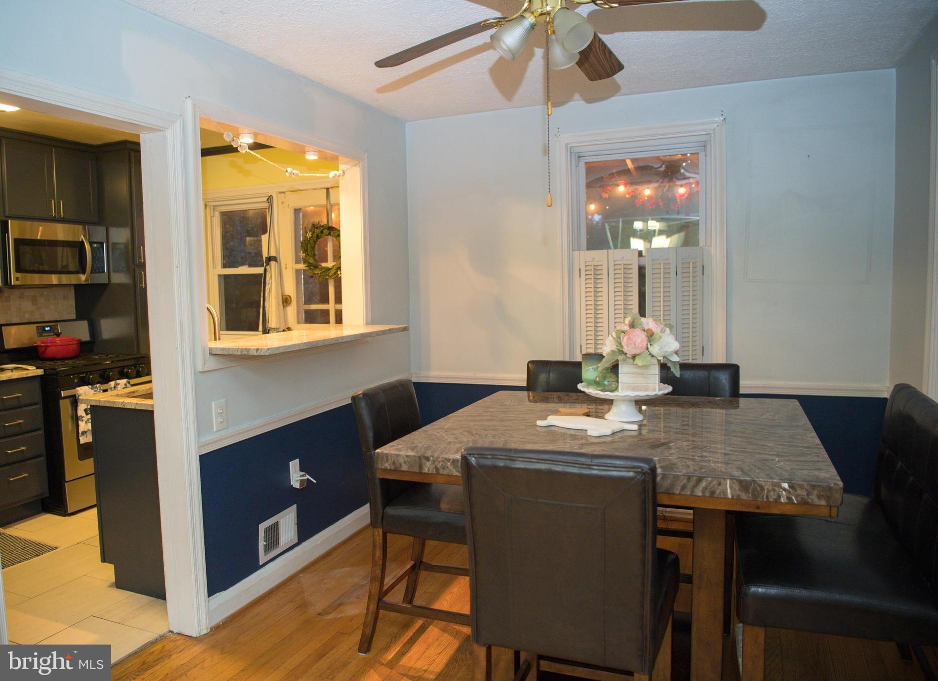 8637 Oak Road Baltimore, MD 21234 - Photo 7 of 18 a view of a dining room with a table and chairs