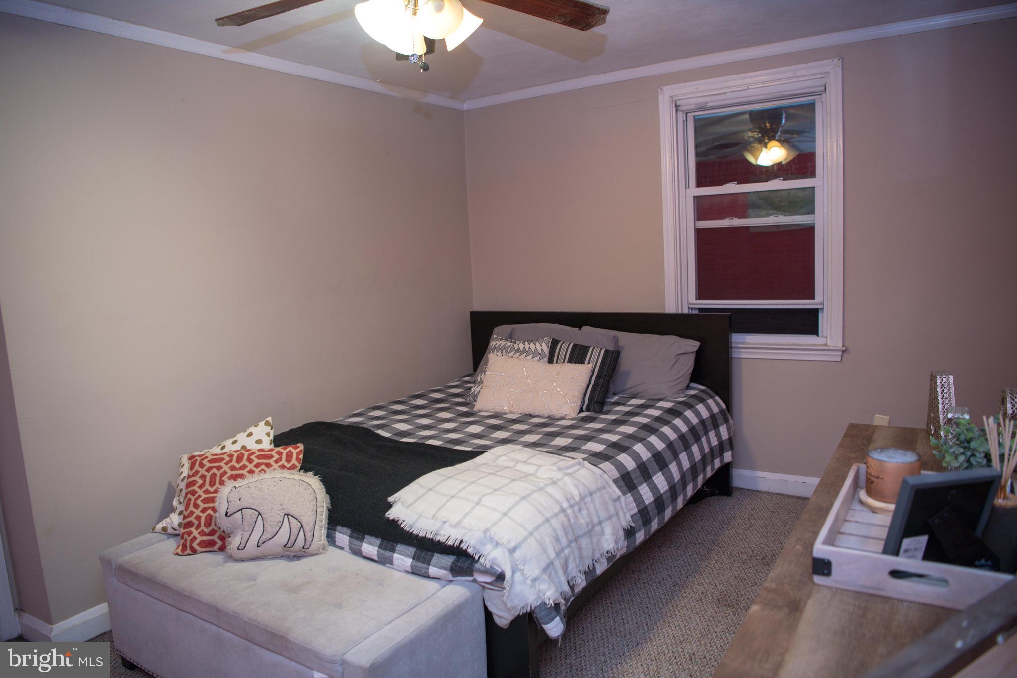 8637 Oak Road Baltimore, MD 21234 - Photo 9 of 18 a bedroom with bed and window