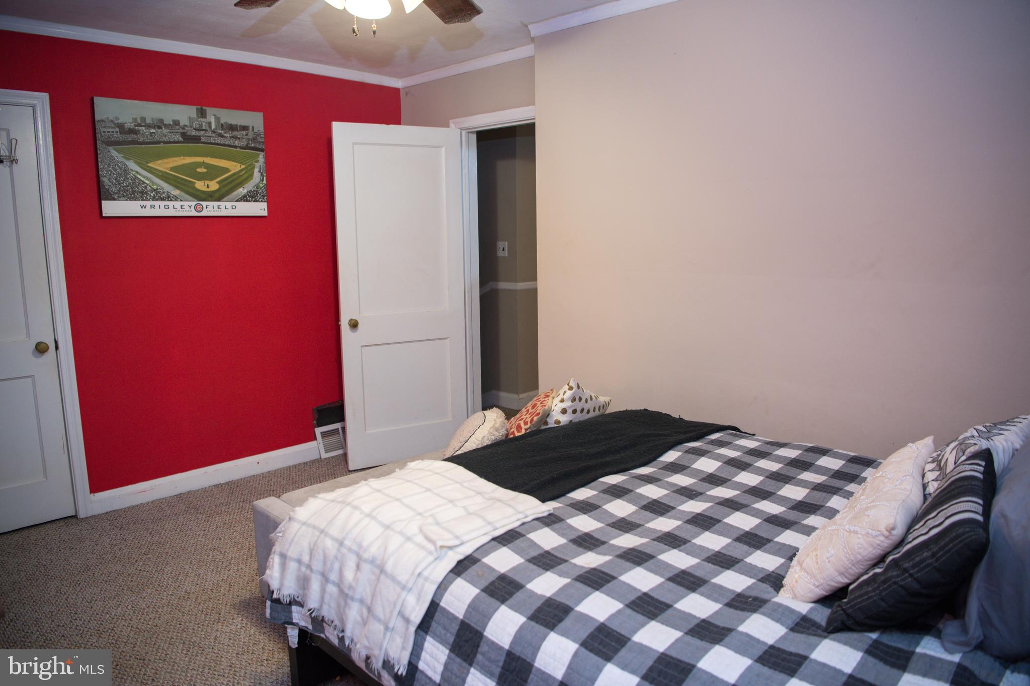 8637 Oak Road Baltimore, MD 21234 - Photo 10 of 18 a bedroom with a bed and a dresser