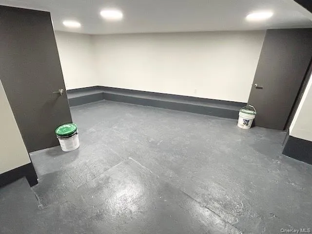 a bathroom with a granite countertop sink a toilet and mirror