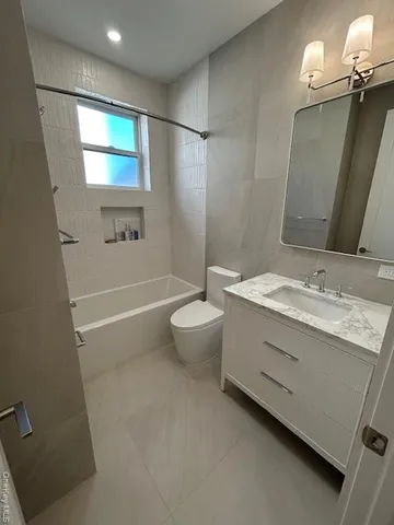 an empty room with closet and wall painting