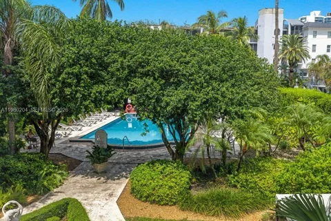 a view of a swimming pool with a yard