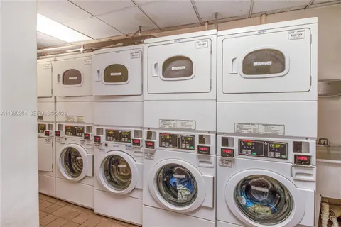 a view of a backyard with furniture and a garden