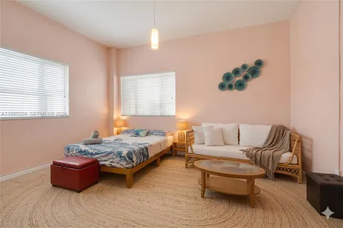 a bedroom with furniture and window
