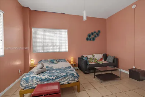 a living room with furniture a flat screen tv and outdoor view