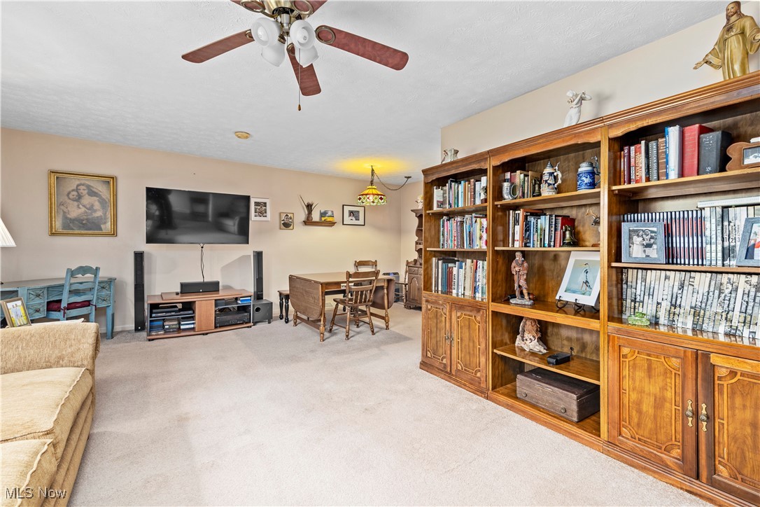 215 Sunset Road Avon Lake, OH 44012 - Photo 8 of 32 Living area with carpet floors and a ceiling fan