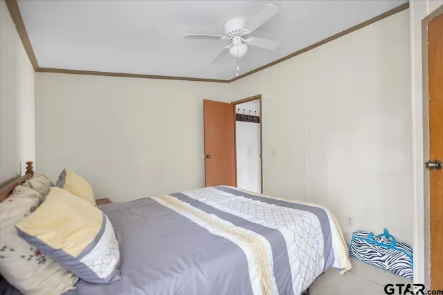 a bedroom with a bed and window