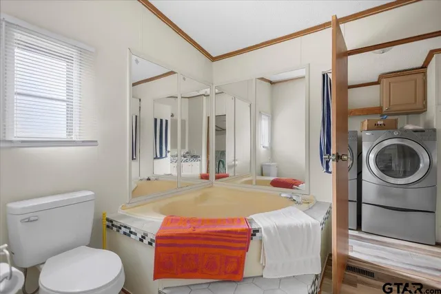 a view of hallway with wooden floor